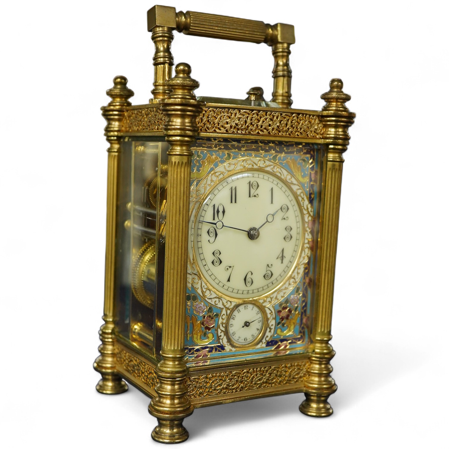 An early 20th century champleve enamel repeating carriage clock with subsidiary dial, with key, 19cm high